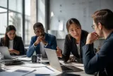 A group of cybersecurity professionals engaged in discussion about AI threats in an office setting.