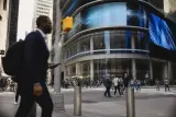 Nasdaq office building with digital screens displaying market data