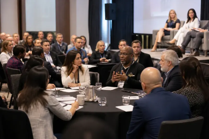 Participants at a roundtable discussing financial strategies
