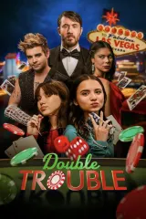 Poster for Double Trouble (2026) showing two sisters and an ex‑MI6 guard in a festive Las Vegas setting