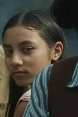 Poster for Our Share of Sand (2026) showing a dusty quarry landscape with a young girl silhouetted against the horizon