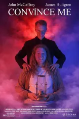 Poster for Convince Me (2026) — a dimly lit table with two figures seated opposite, one shadowed suggesting the Devil