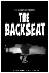 The Backseat (2026) movie poster showing a dark car interior with a glowing pair of eyes in the backseat
