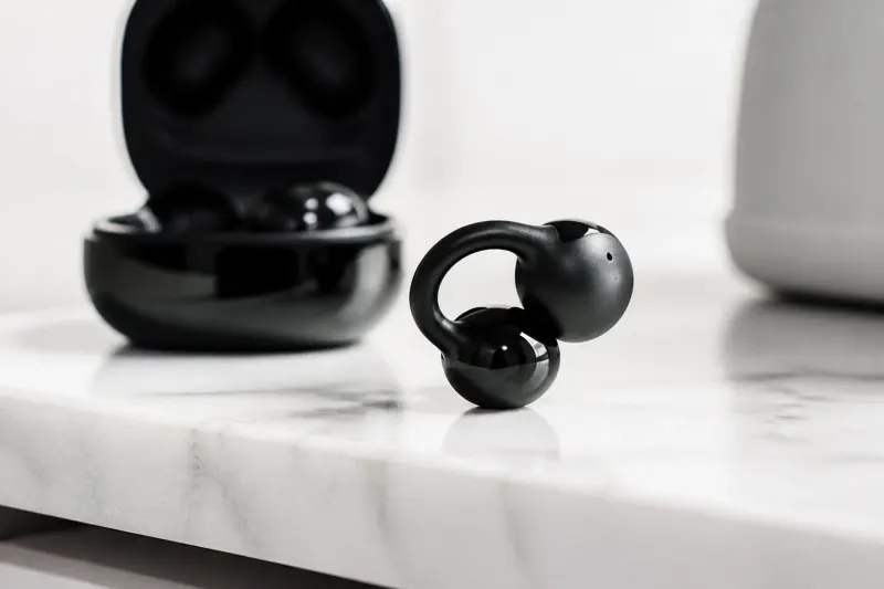 A close-up of the Sony LinkBuds Clip in black, showcased with their unique clip-style design.