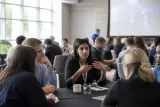 AI conference with industry professionals discussing safety measures