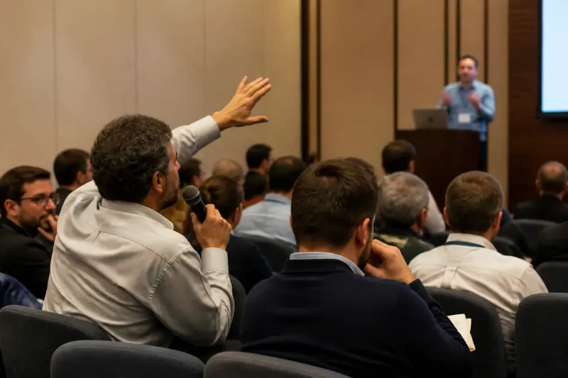 A public feedback session with mathematicians discussing AI impacts.