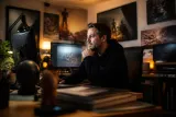Tonda Ros in a game development setting, immersed in his Steam library