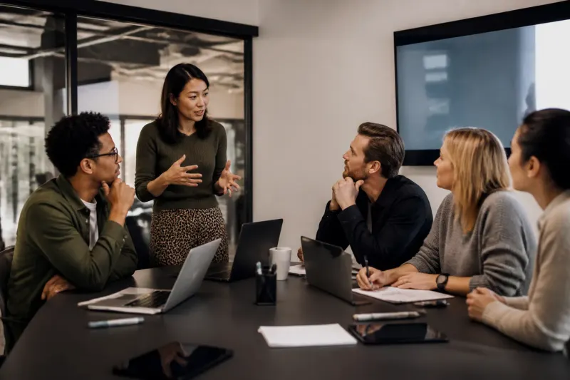 Employees collaborating on security solutions