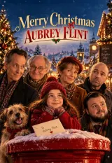 Poster for Merry Christmas Aubrey Flint (2026) showing John Bradley as Aubrey Flint among a group of elderly actors in a festive rehearsal space
