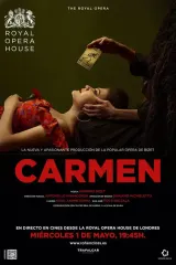 Poster for Royal Opera House: Carmen (2026) featuring Aigul Akhmetshina as Carmen in a red dress against a stark, sun-bleached set