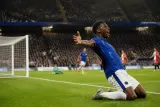 An exciting moment in a Premier League match showcasing a player celebrating after scoring as a substitute.