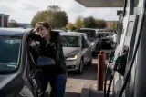 A gas station displaying rising fuel prices in the UK.
