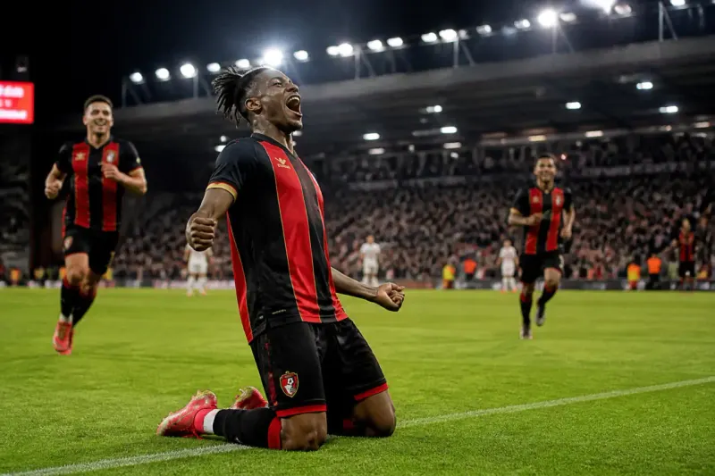 Bournemouth players celebrating their victory over AC Milan