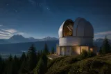 An observatory dome situated under a starry night sky.