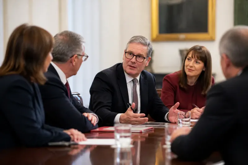 Political leaders gathered discussing responses to budget proposals