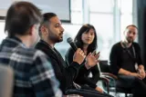 Game developers discussing the impact of AI in the gaming industry at a Valve event.