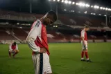 Arsenal players leaving the pitch after their defeat to Fleetwood Town